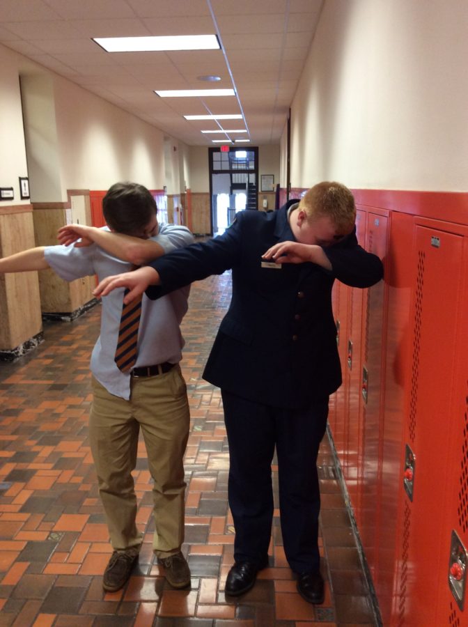 Mitch Clark (left) and Tyler Smith (right) show off their dabbing ability in the halls of Cathedral Prep
